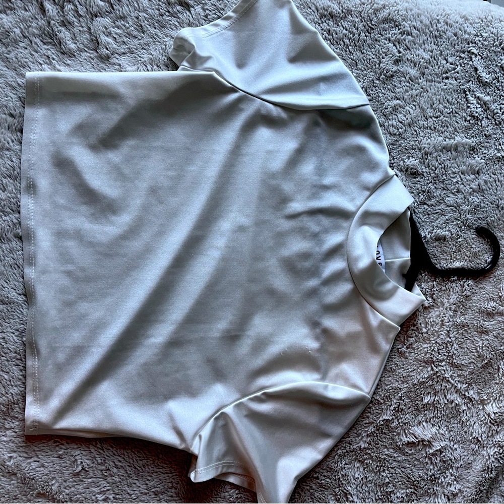 A white silk shirt, Turtleneck-ish.